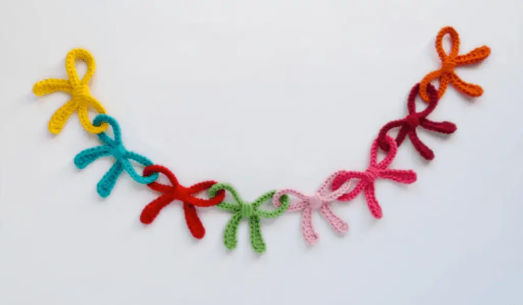 Garland of bows in yellow, blue, red, green, pink, and orange.