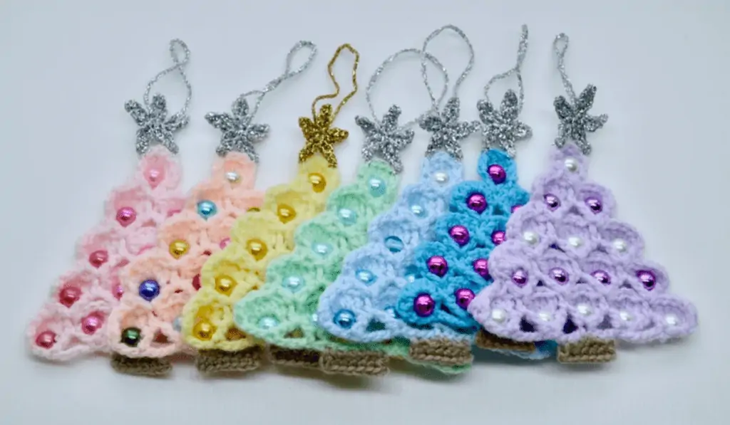 Christmas tree ornaments that look like mini Christmas trees with tiny beaded ornaments on them.