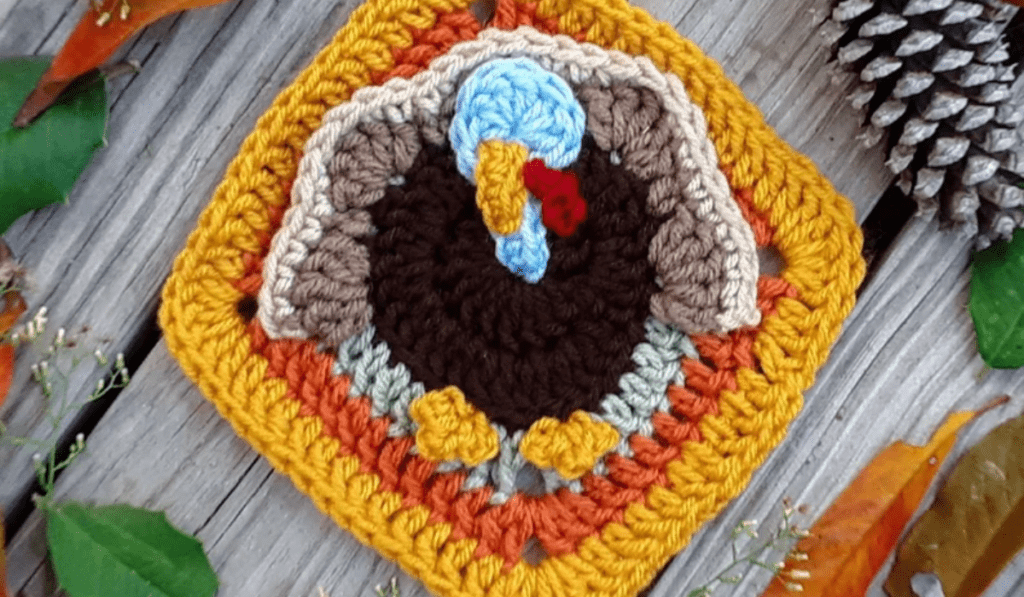 A granny square with a turkey on it.
