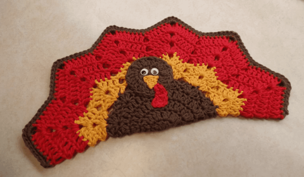 A half circle crochet turkey placemat.