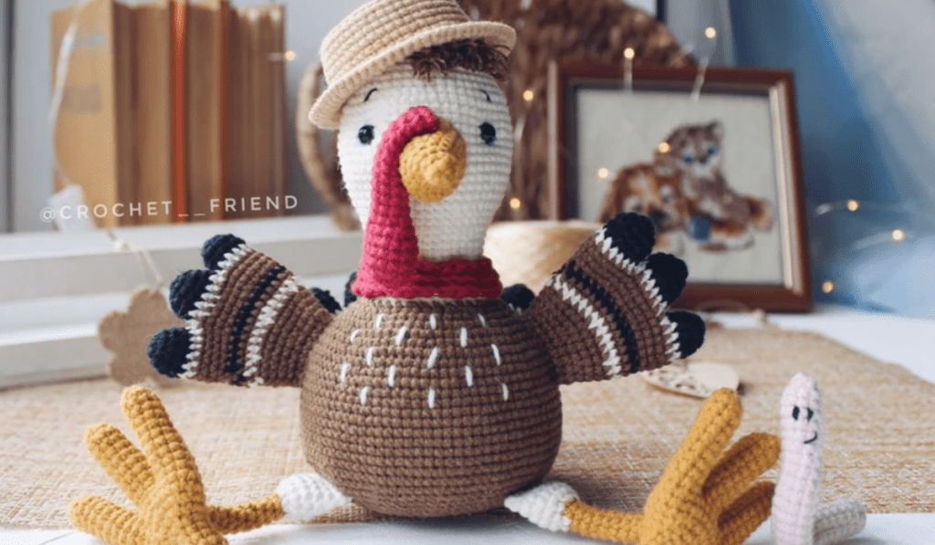 Hyper-realistic crochet turkey wearing a flat cap.