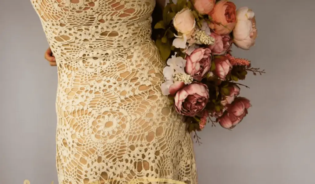 Flower-looking lace on a form-fitting dress.