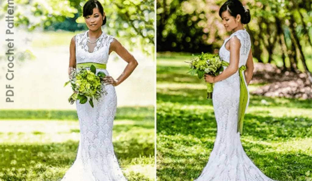 An elegant wedding dress that's all lace with a green bow around the waist.