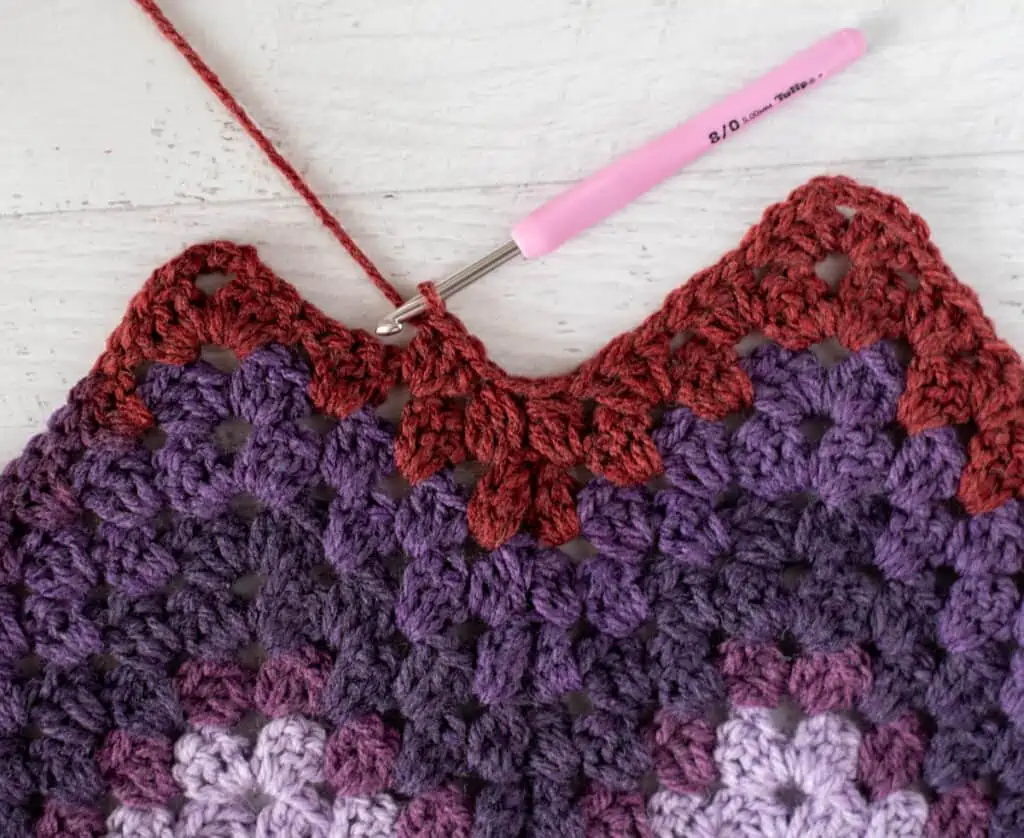 Purple and burgundy Crochet afghan step by step photo with pink crochet hook