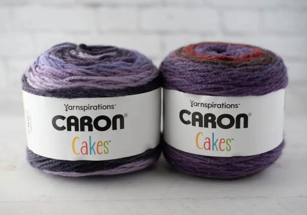 Two cakes of purple yarn