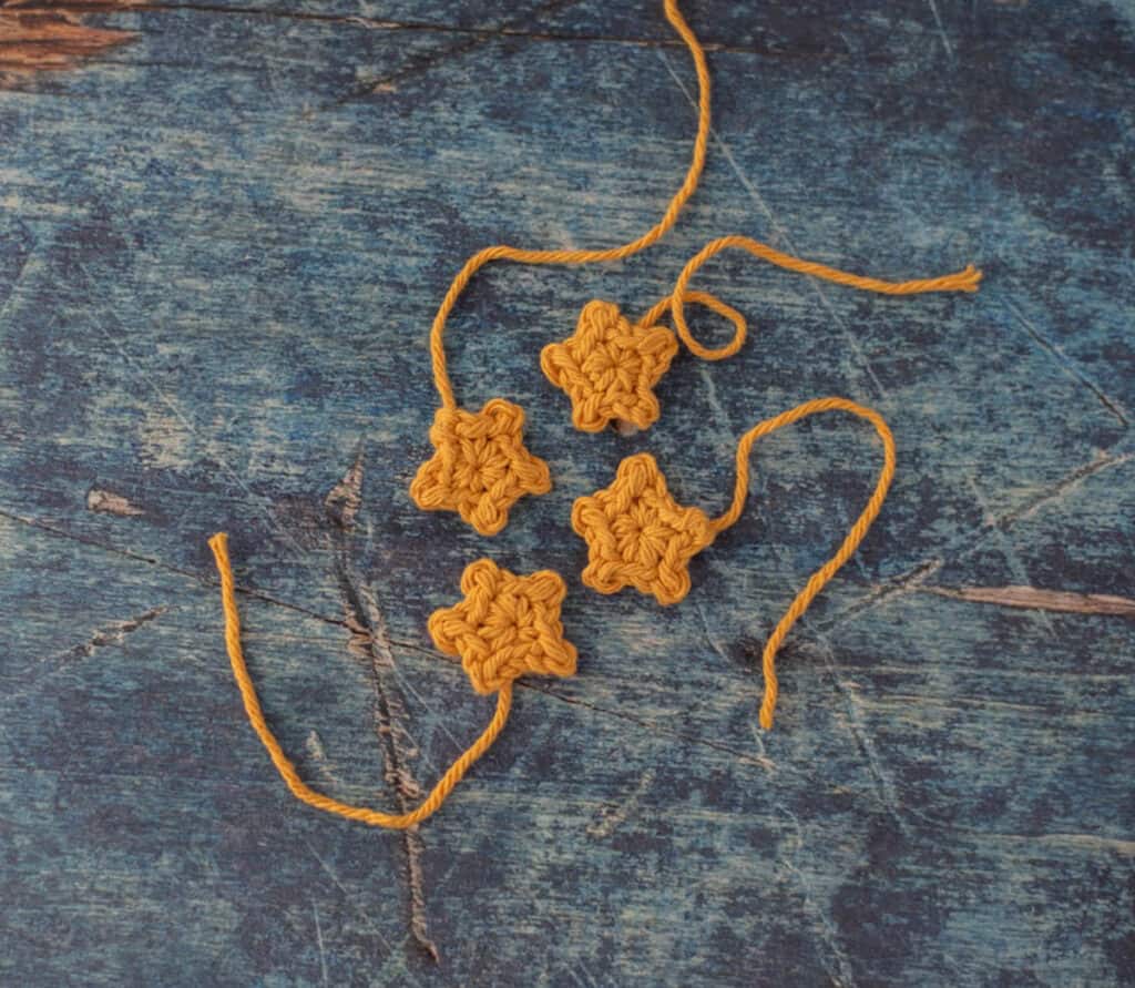 Four gold crocheted stars