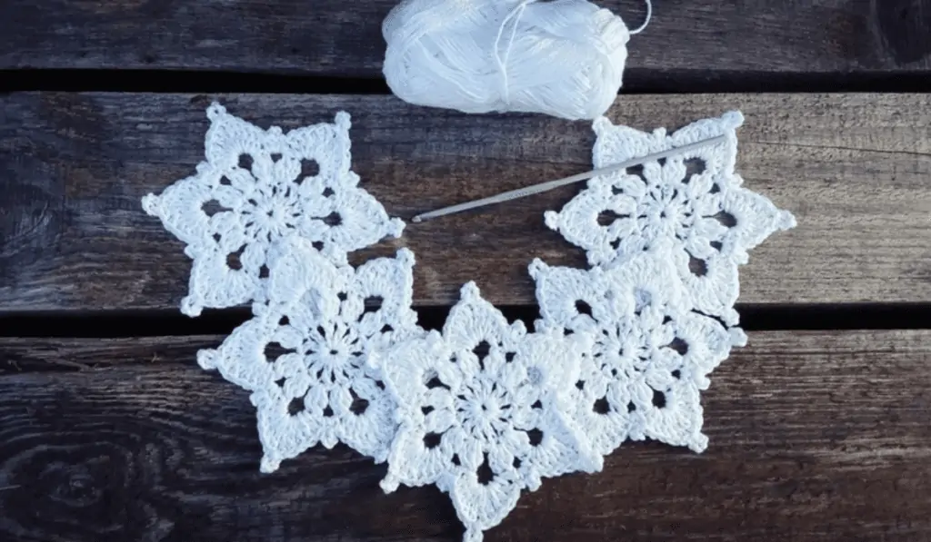 A crochet snowflake with thick borders.
