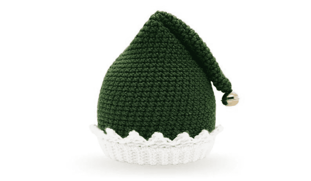 A dark green crochet elf hat with a jingle bell on top.