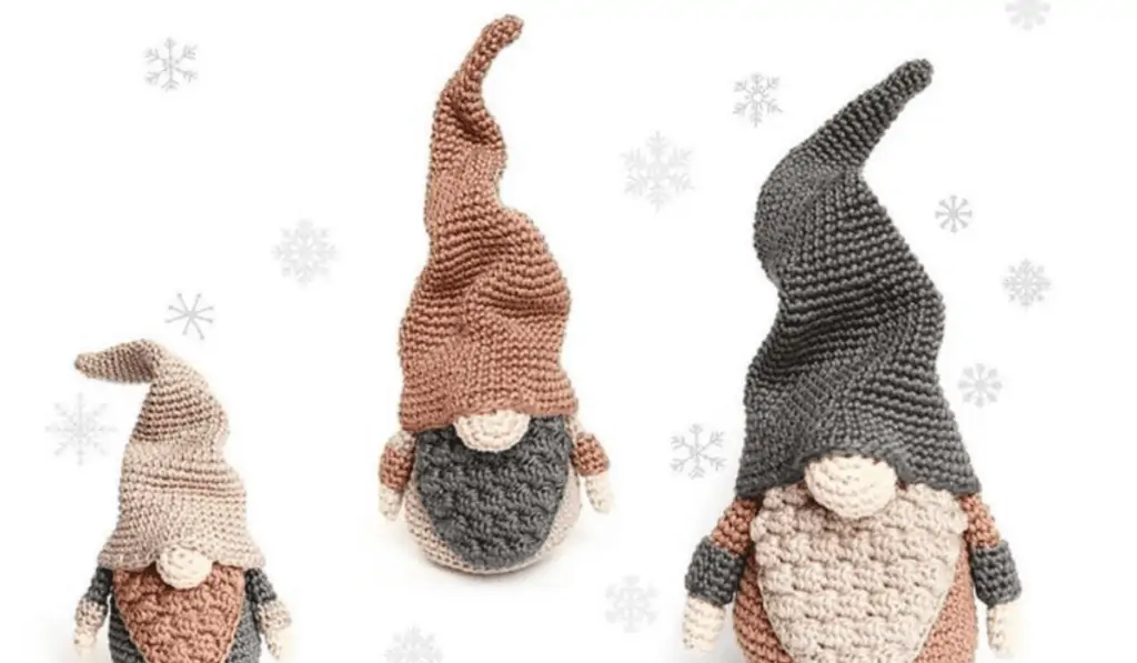 Three grey, brown, and white gnomes with twisting hads and beards
