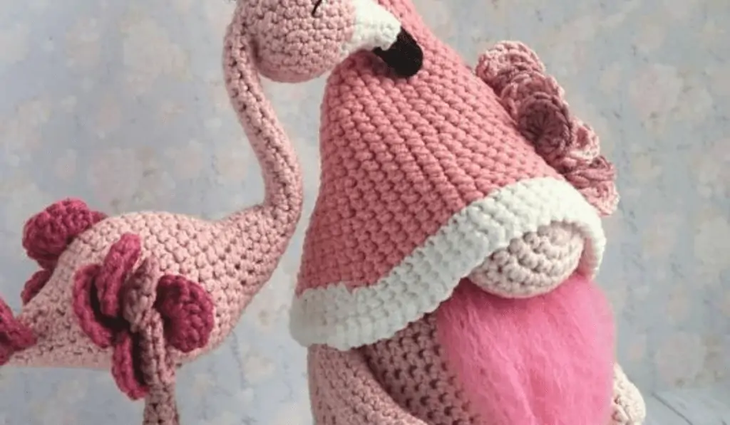 pink crochet flamingo gnome with another flamingo
