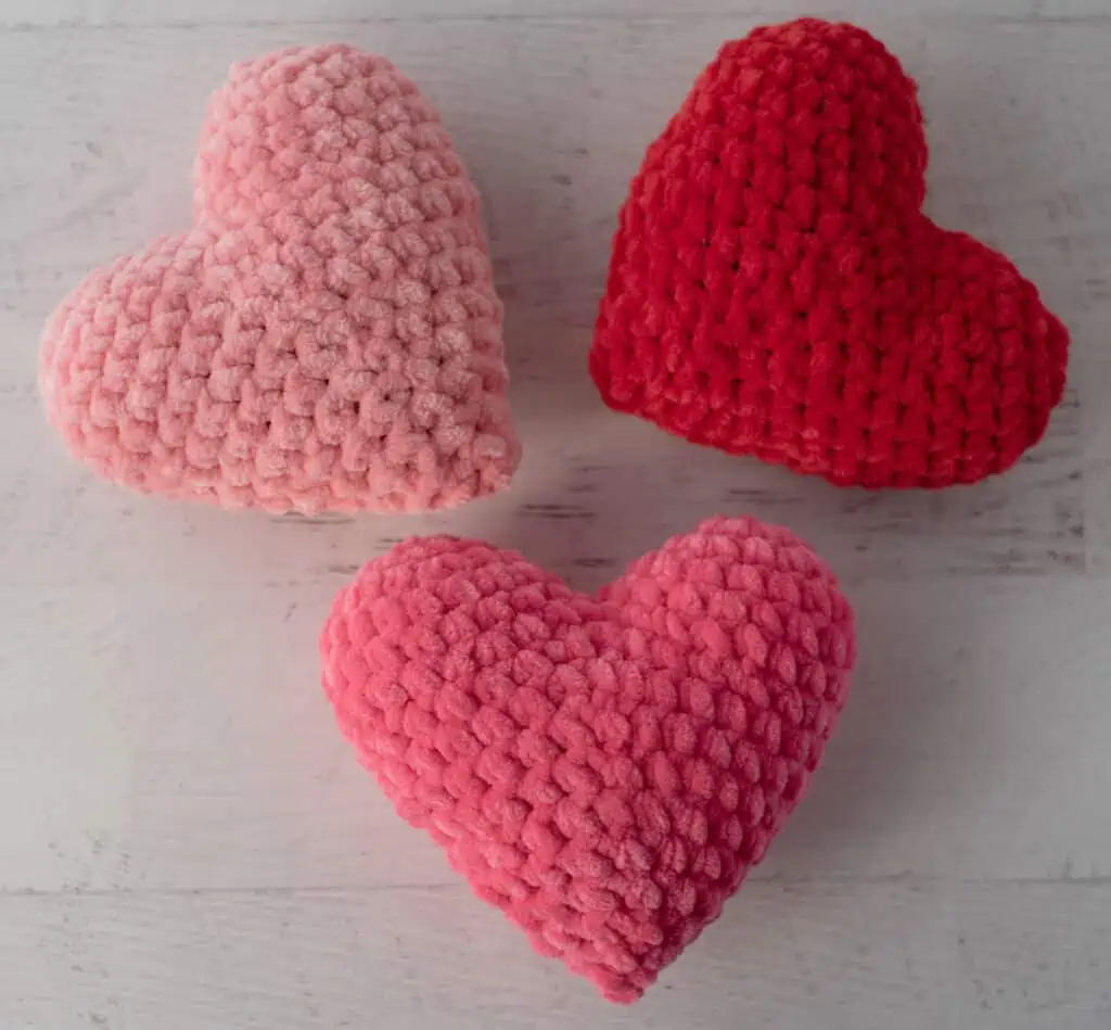 stuffed pink and red crochet amigurumi hearts