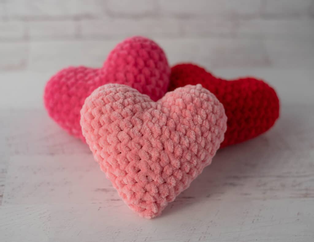 stuffed pink and red crochet amigurumi hearts