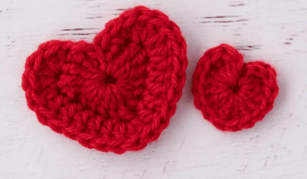 Two crochet red hearts