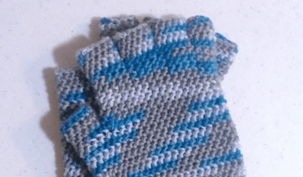 Blue, white, and grey crochet fingerless gloves.