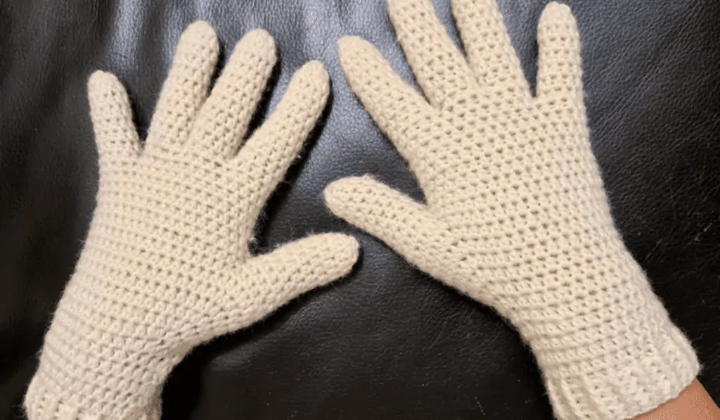 All white crochet gloves.