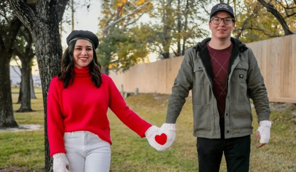 A joined crochet mitten so that two people can holkd hands while wearing the mitton.