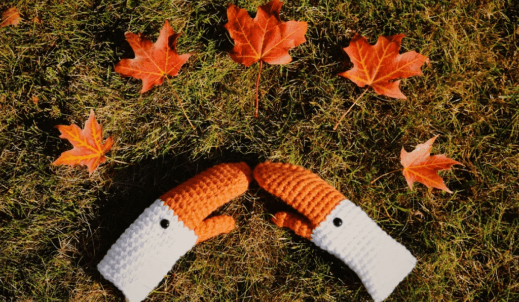 Crochet mittens that look like geese.