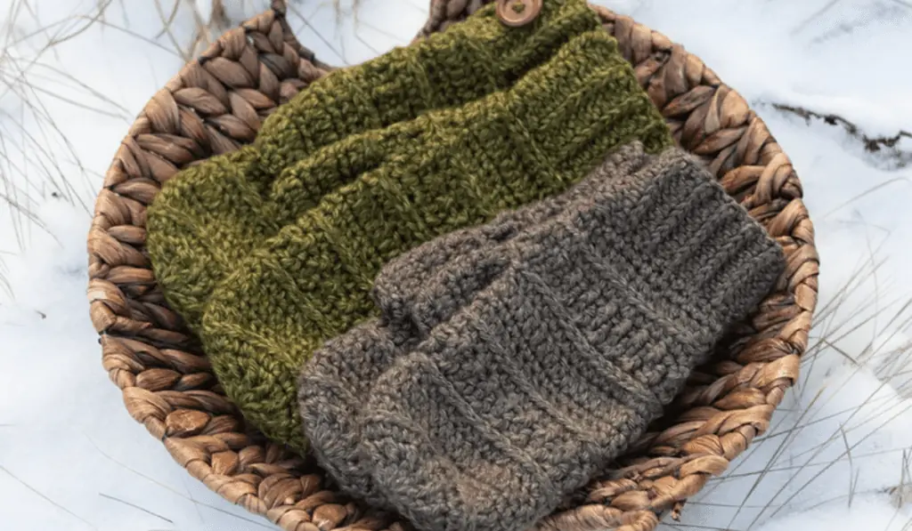 Two pairs of crochet mittens, one in green and one in grey.