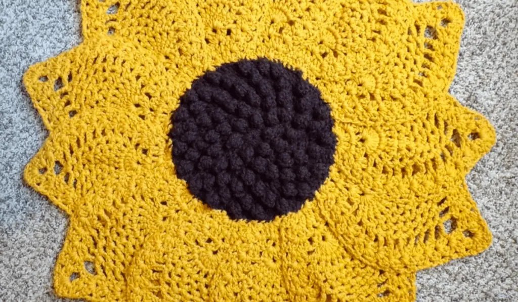 A sunflower crochet rug.