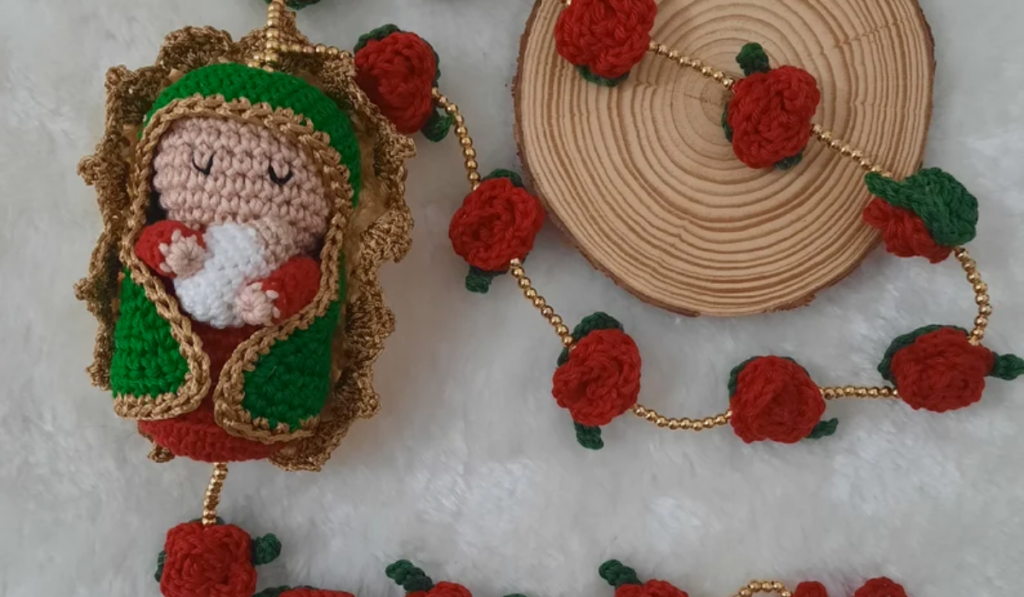 A rose rosary with an amigurumi of our lady Guadalupe.