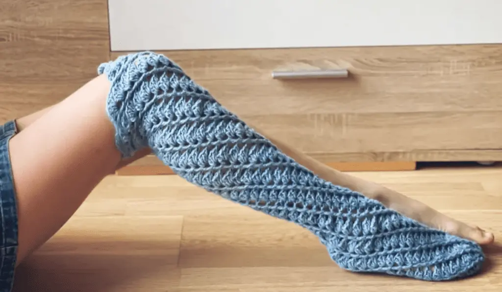 Twirling crochet socks in blue.