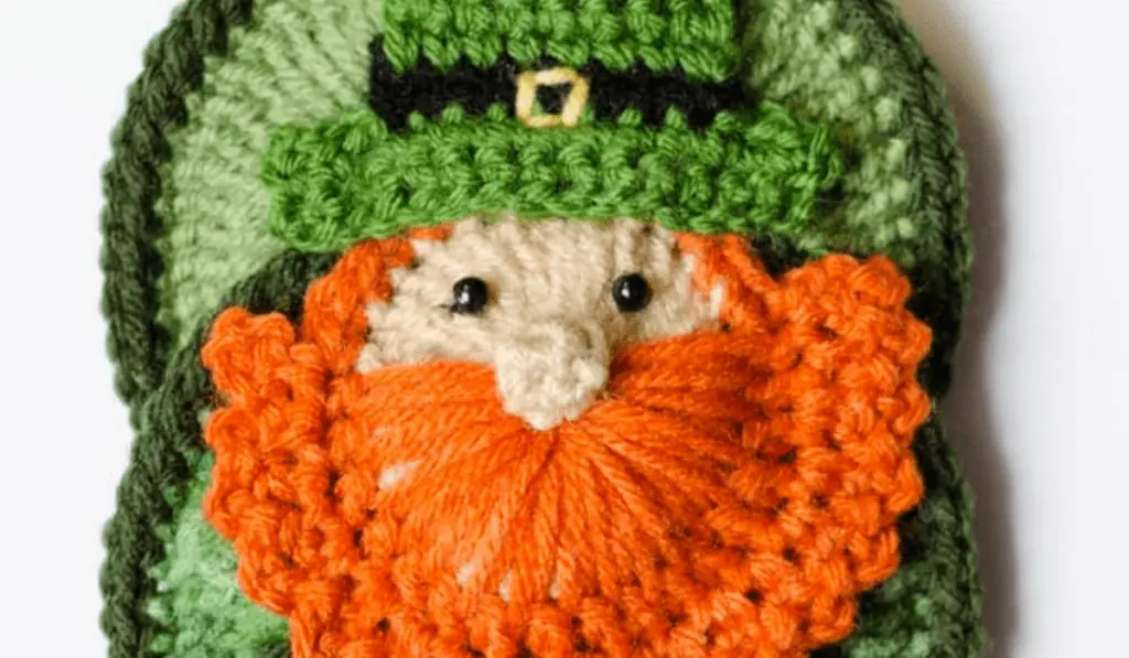 A flat crochet leprechaun applique.