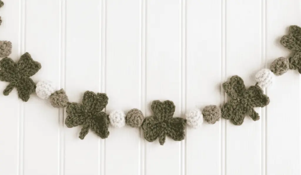 A garland of crochet shamrocks.