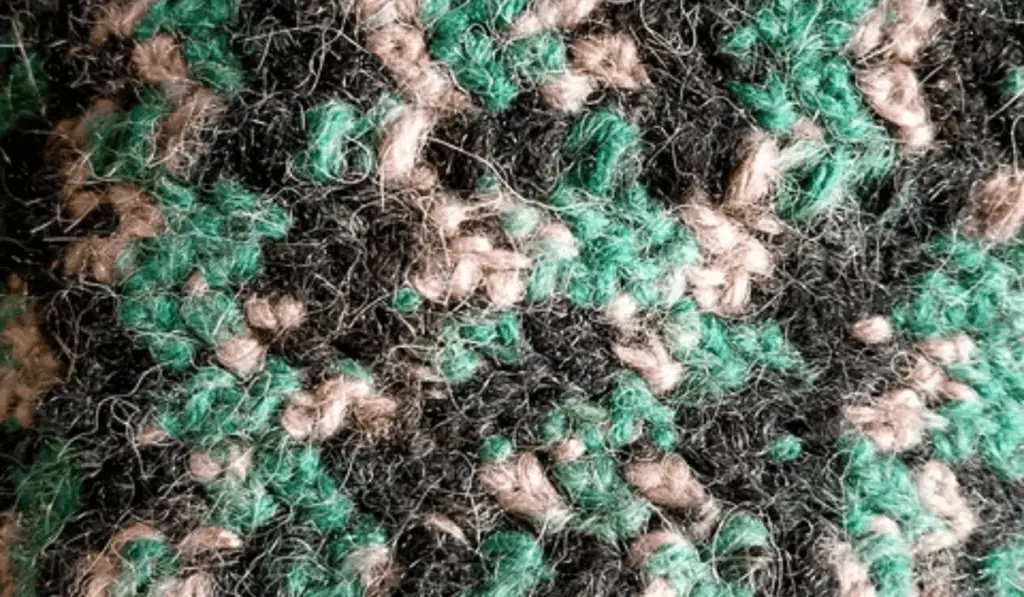 A close up of different crochet stitches.