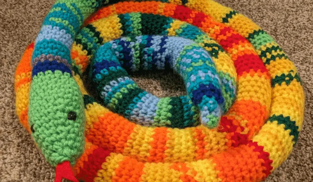 A crochet snake that is used to record the temperature.