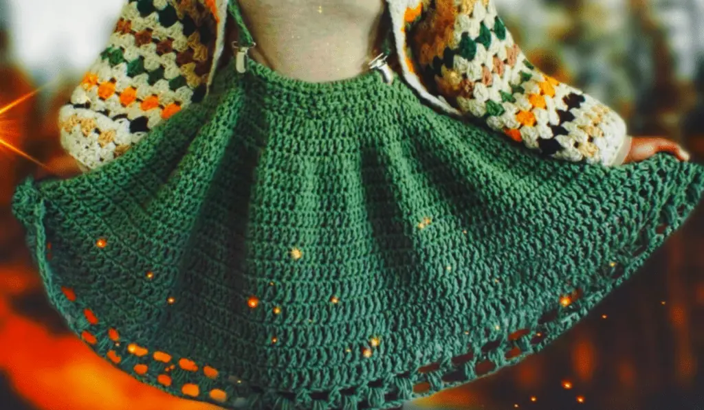 A green crochet skirt with suspenders