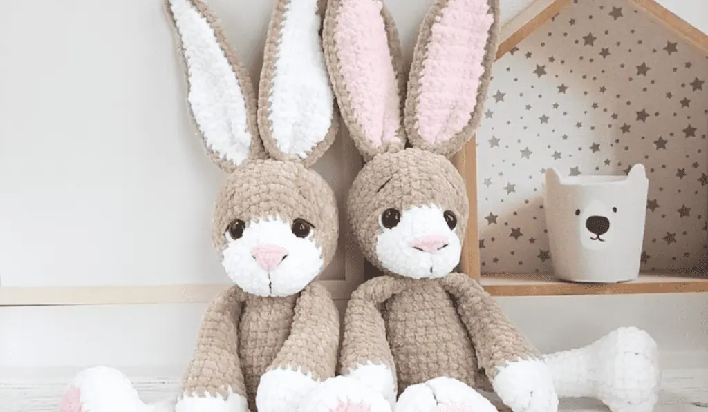 Two brown amigurumi bunnies