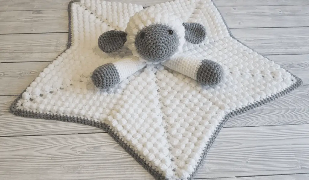 A crochet lovey sheep