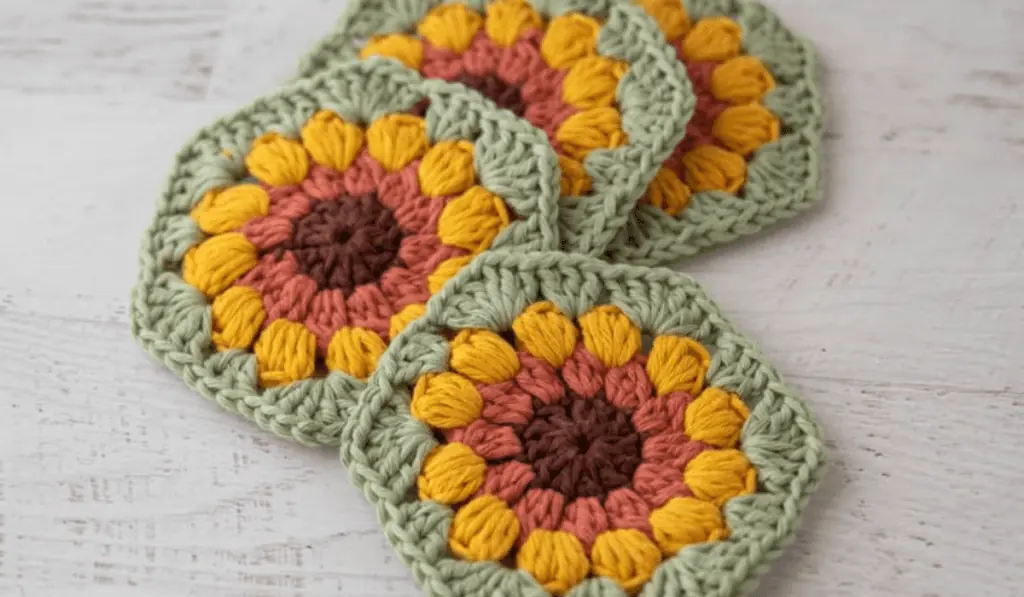 Crochet sunflower coasters with green background