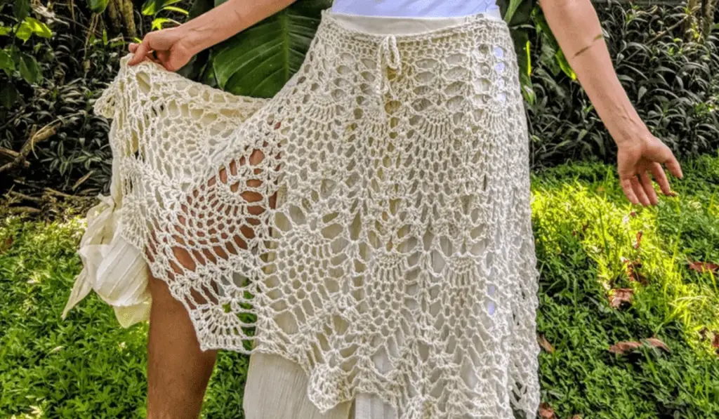 a lacy crochet skirt in off-white yarn