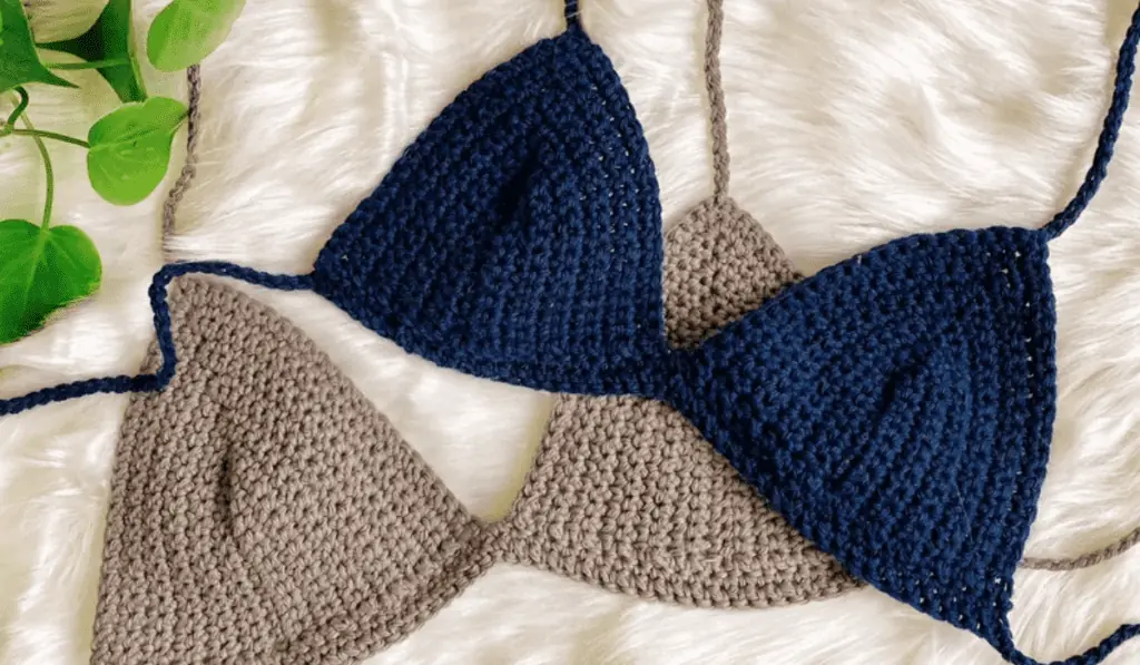 Two crochet bikini tops, one in blue and one in beige.