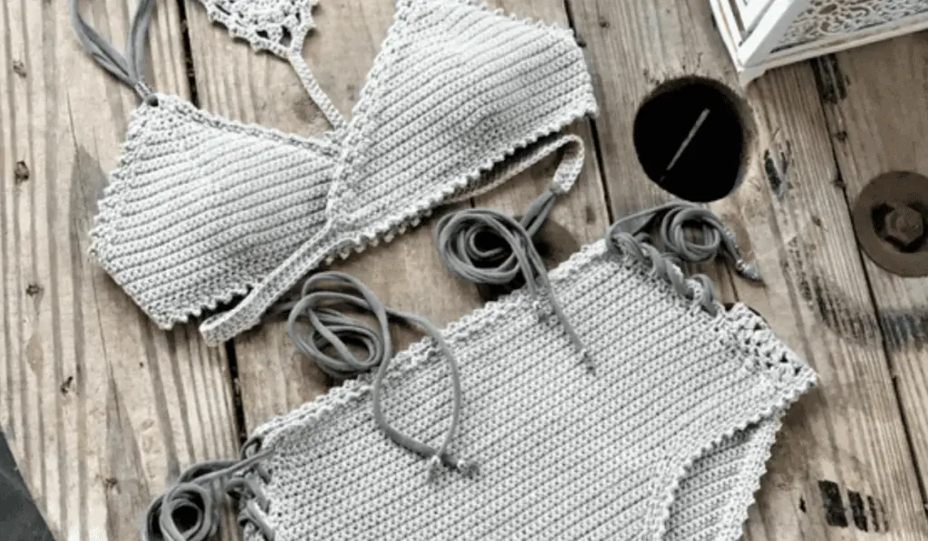 A wrap-around crochet bikini top with high-waisted bottoms.