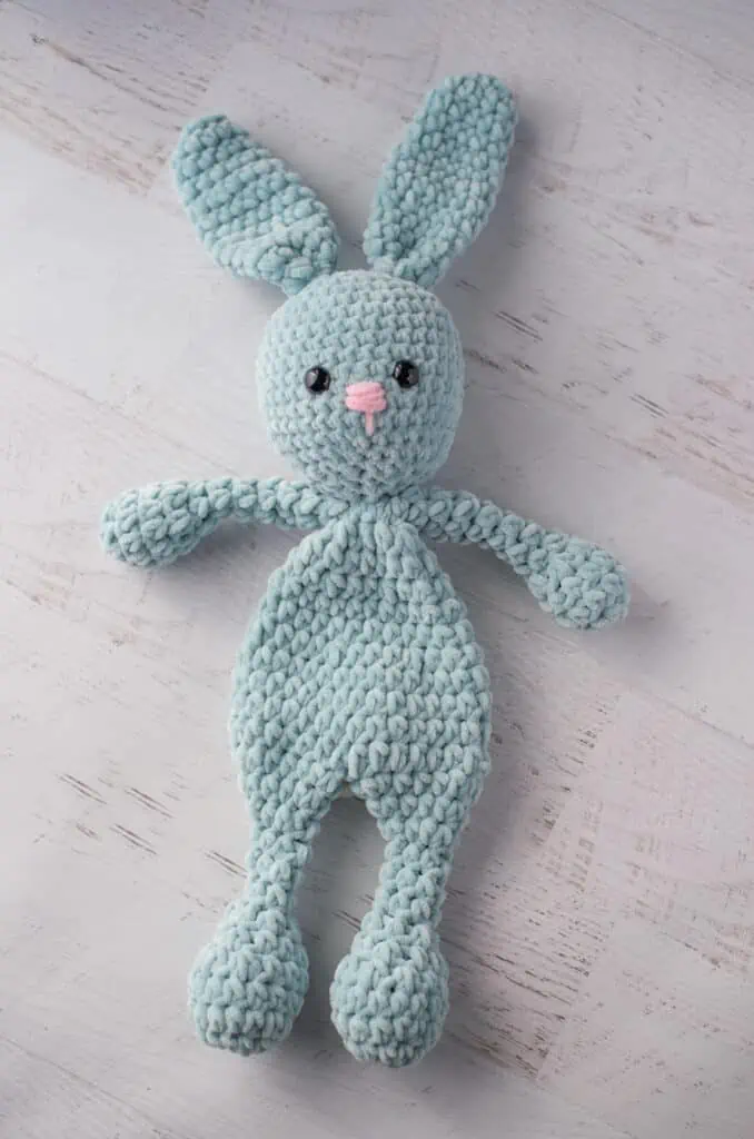 blue bunny crochet snuggler with pink nose
