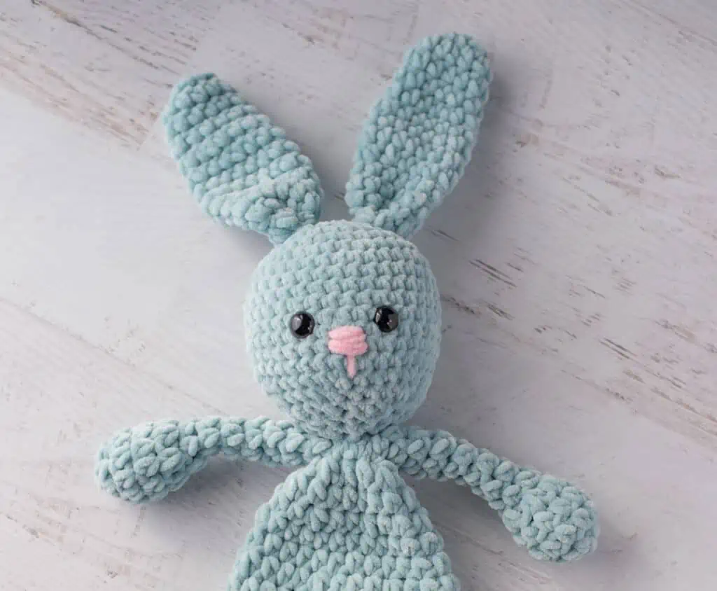 blue bunny crochet snuggler with pink nose