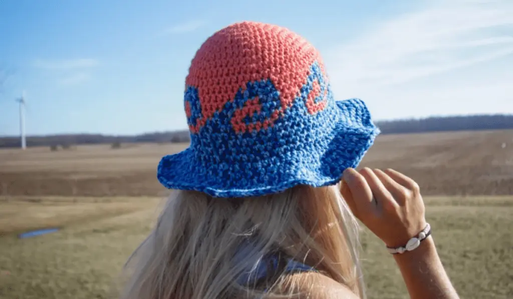 A crochet bucket hat with a wave design on it.