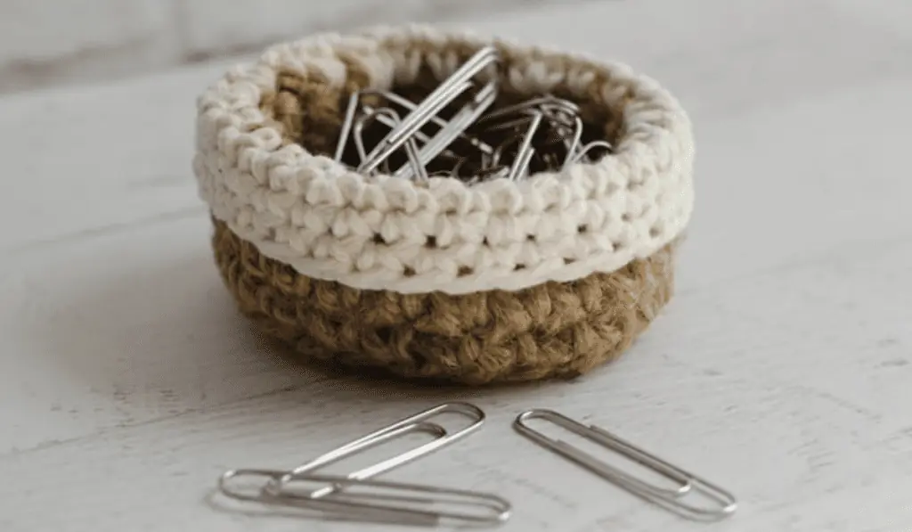 A small crochet basket that fits paper clips.