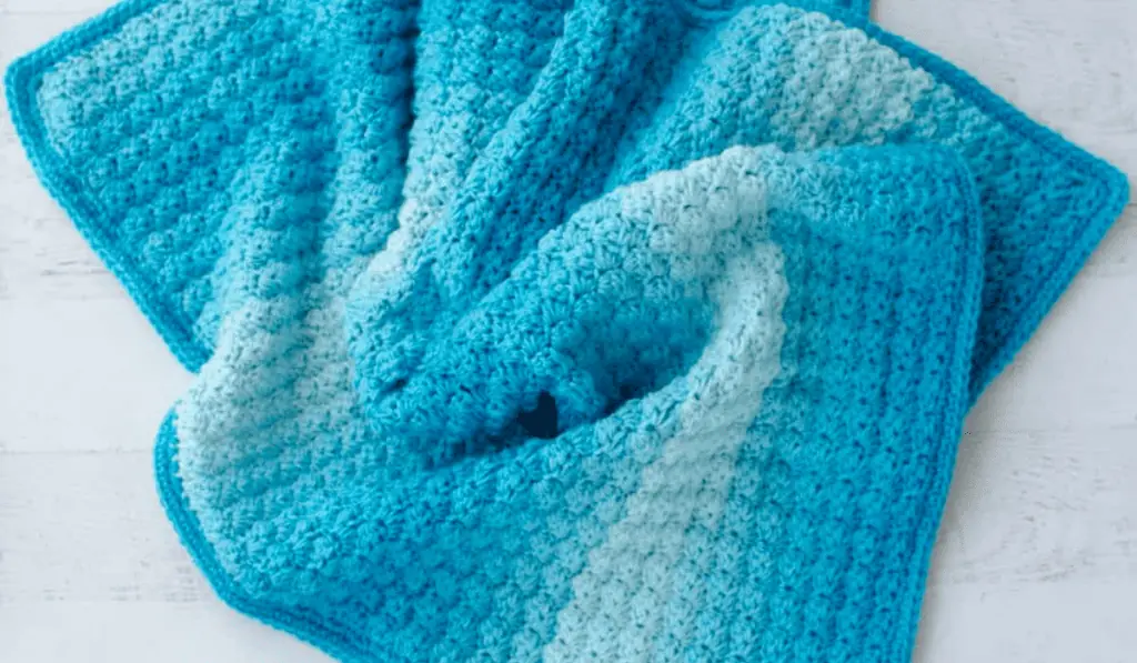 A blue ombre crochet baby blanket pattern.