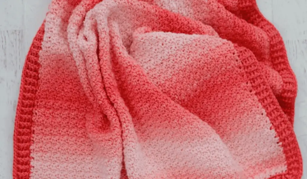 A pink ombre crochet baby blanket pattern.