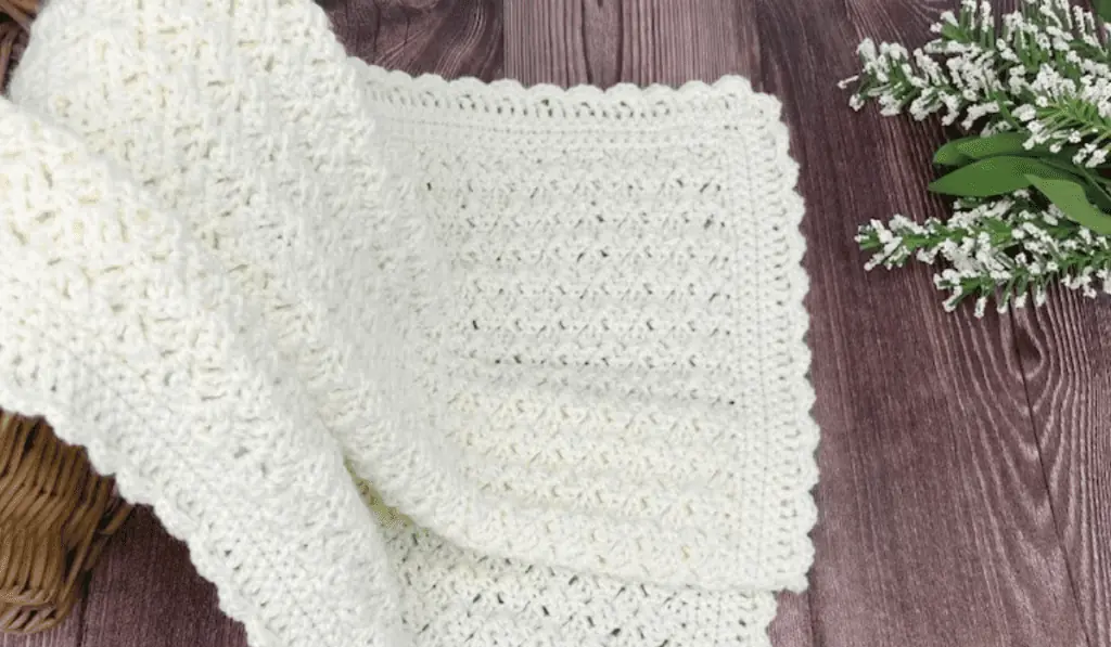 A white crochet baby blanket pattern.