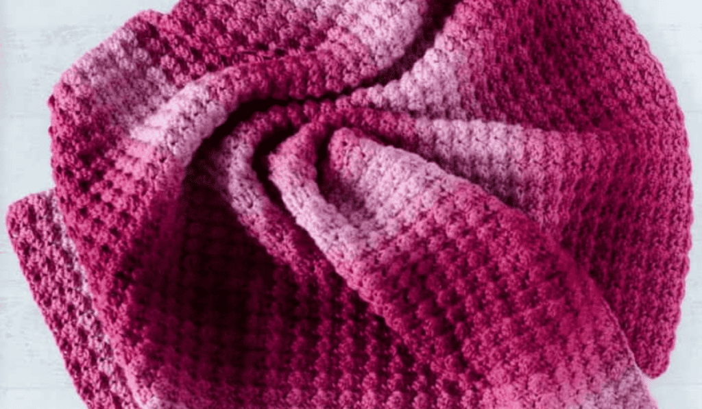 A pink ombre crochet baby blanket pattern
