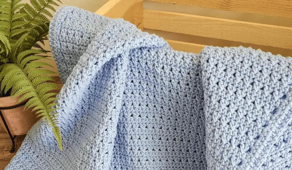A simple, light blue baby blanket.