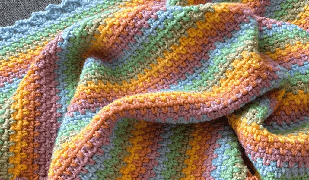 Crochet Blanket with Variegated Yarn and Lemon Peel Stitch 