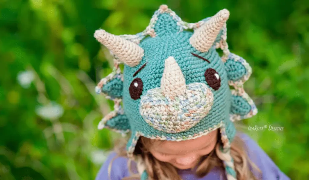 A crochet dinosaur hat.