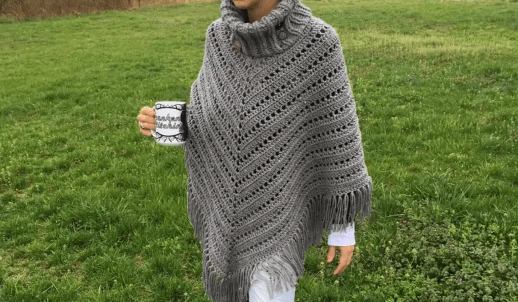 A grey crochet poncho pattern with a turtleneck