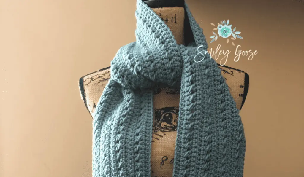 A light blue textured scarf.