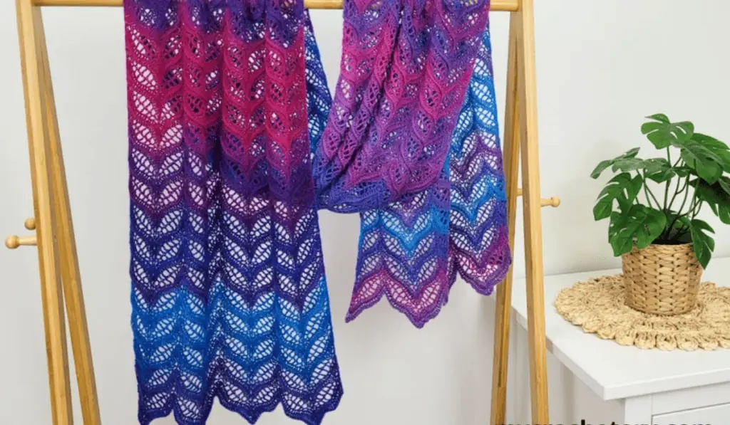 An airy scarf with purple, blue, and pink ombre of colors.